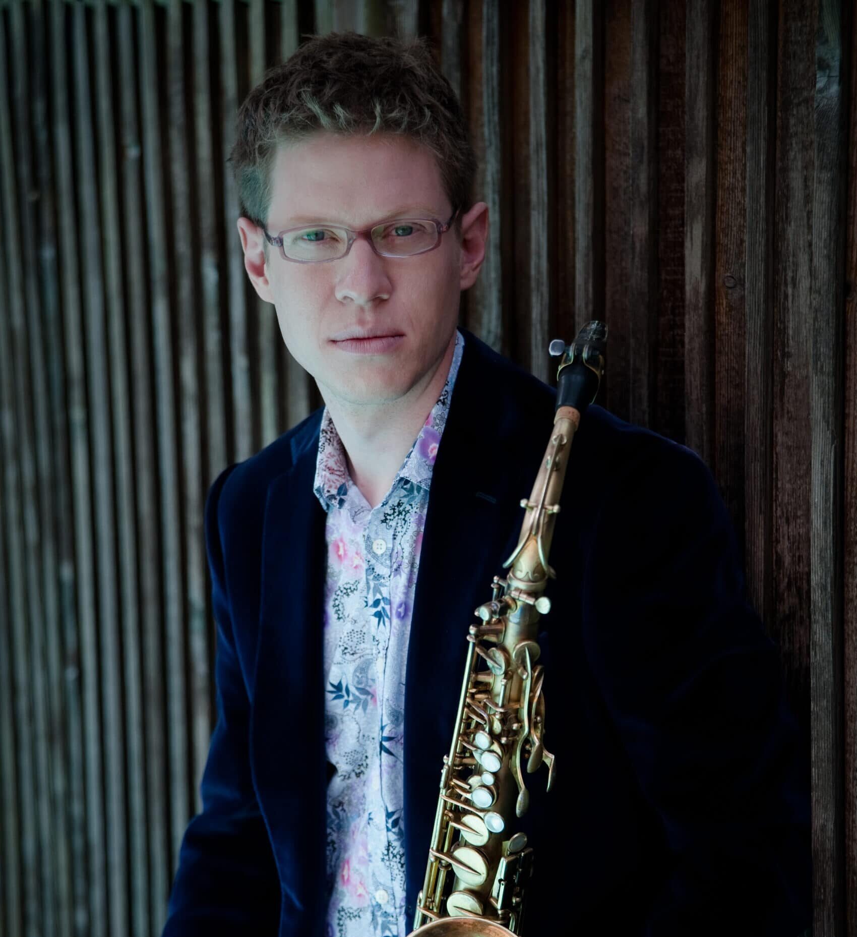 Wallace Halladay standing holding saxophone