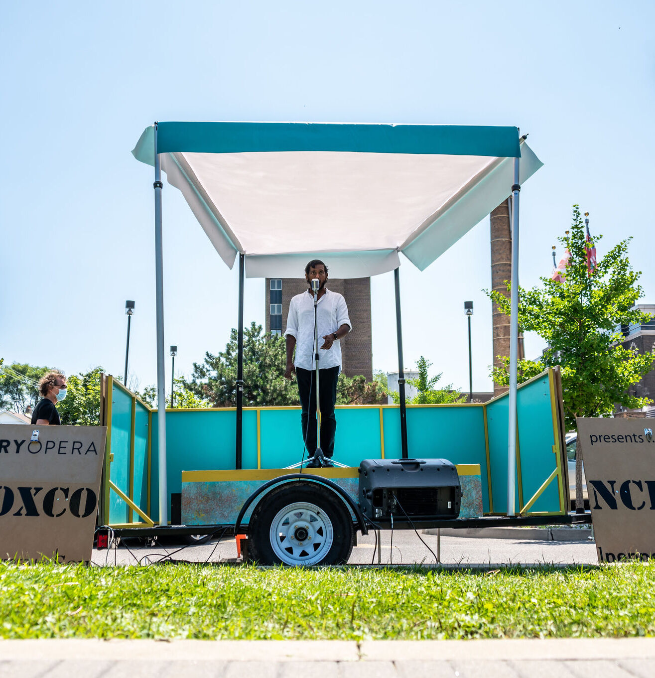 Asitha Tennekoon singing on a pop up stage